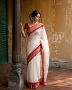 Shreya — Off-White Mulmul Cotton Saree with Red Border | Awadhalaya